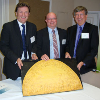 Chair of the CDFA, Jonathan Diggines, Richard Wilcox, Managing Director of Unity Trust Bank, and Steve Walker, Chief Executive of ART, with the giant pattie made by Island Delight.